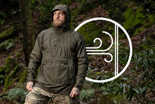 Man wearing a windbreaker with hood up in front of a symbol showing wind hitting a surface.